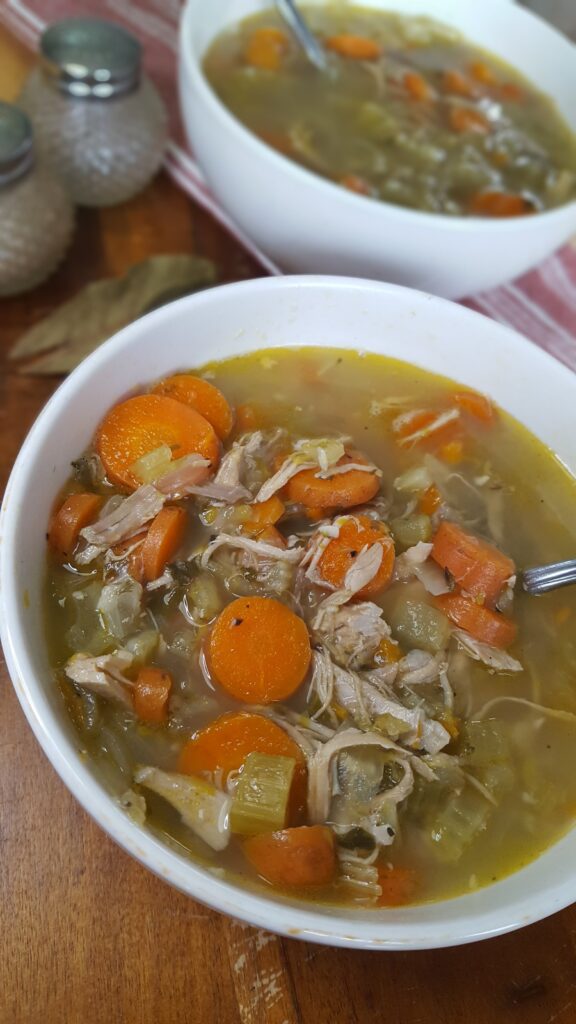 Using the leftovers from any bone-in chicken, this Whole30 leftover chicken soup is the perfect soul soothing meal during colder weather.
