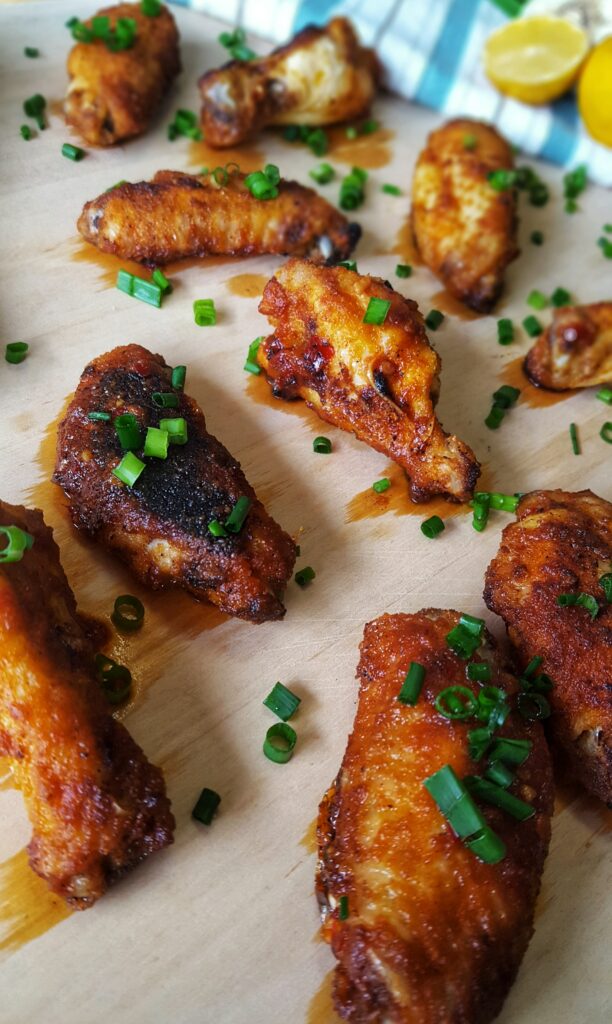 These wings are lightly battered in a coconut flour breading, baked in a super hot oven and then drenched in a General Tso's style sauce.