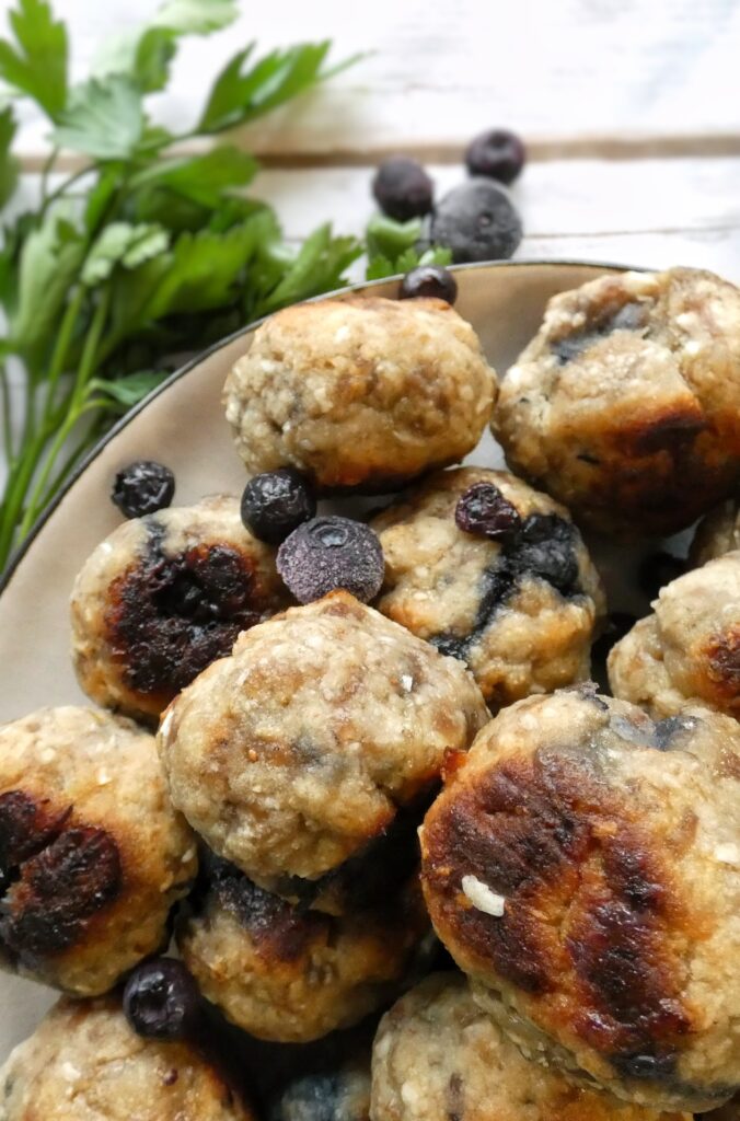 A gluten, grain and dairy-free pancake mixture gets mixed into savory breakfast sausage to make these delicious breakfast meatballs!