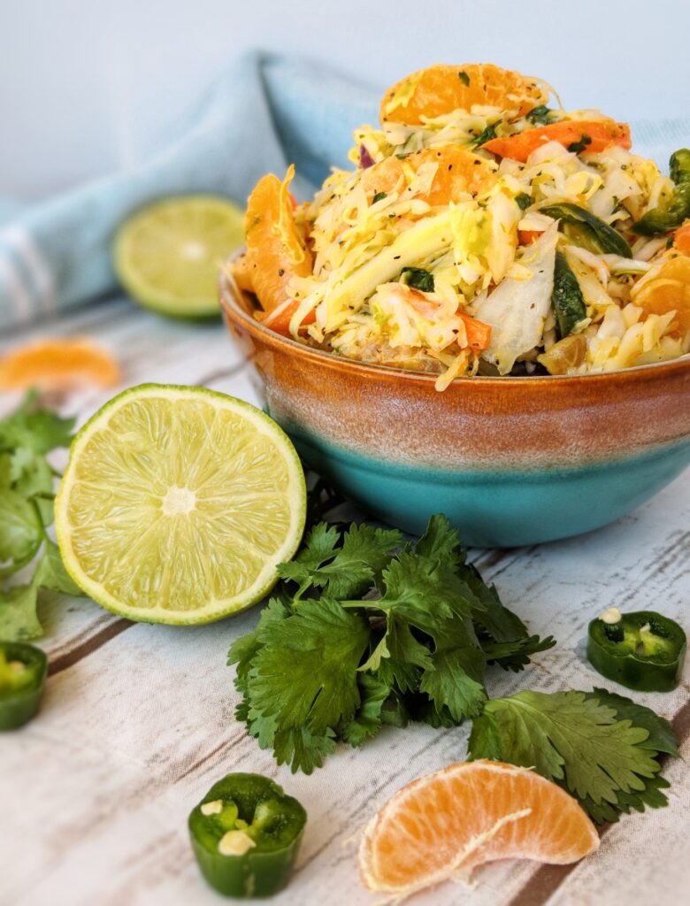 Fiery jalapenos meet refreshing citrus fruits and crispy cabbage in this delicious Whole30 Spicy Citrus Cilantro Coleslaw.