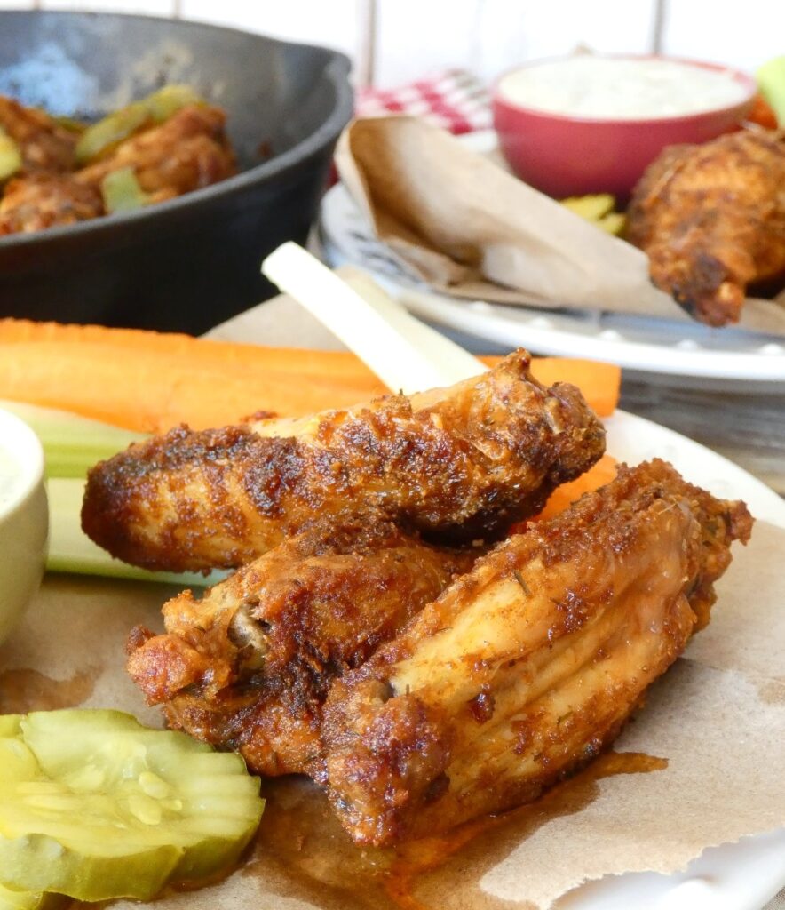 Marinaded in pickle juice before being "fried" in an oven or air fryer, these Whole30 compliant and Keto-friendly chicken wings are the healthified version of Nashville Hot Chicken.
